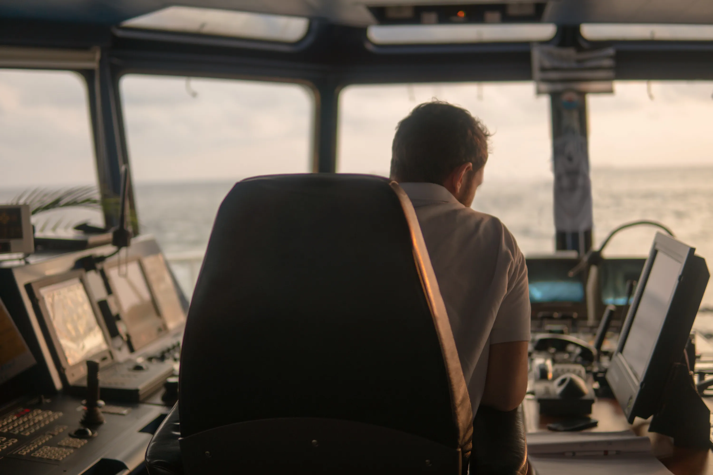 Deck navigation officer on the navigation bridge. He looks at radar screen